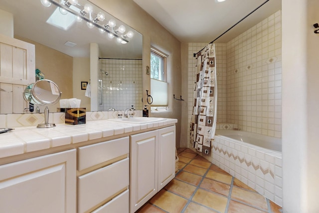 425 Calle Kokopelli, Santa Fe, NM 87501 - bathroom featuring tile patterned floors, vanity, and tiled shower / bath combo