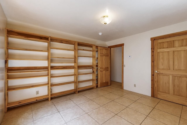 76 Los Altos De Cicuye, Pecos, NM 87552 - unfurnished bedroom featuring light tile patterned floors