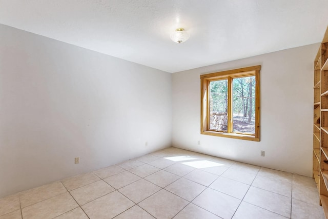 76 Los Altos De Cicuye, Pecos, NM 87552 - empty room with light tile patterned floors