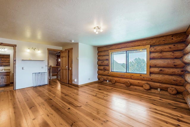 76 Los Altos De Cicuye, Pecos, NM 87552 - unfurnished room featuring light wood-style floors and a textured ceiling