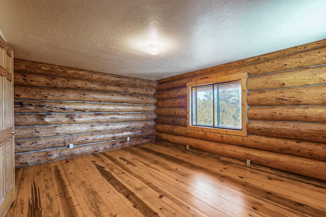 76 Los Altos De Cicuye, Pecos, NM 87552 - spare room with a textured ceiling and hardwood / wood-style flooring