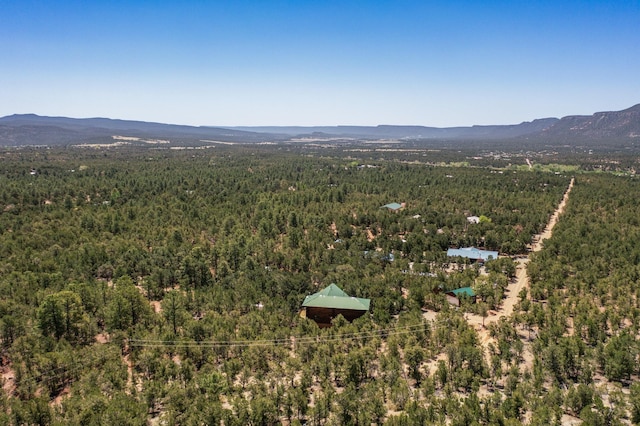 76 Los Altos De Cicuye, Pecos, NM 87552 - drone / aerial view of a heavily wooded area and a mountainous background