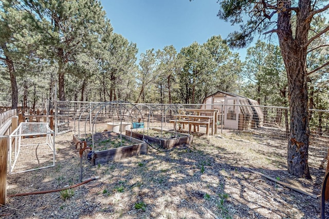 76 Los Altos De Cicuye, Pecos, NM 87552 - view of yard with a garden and an outbuilding