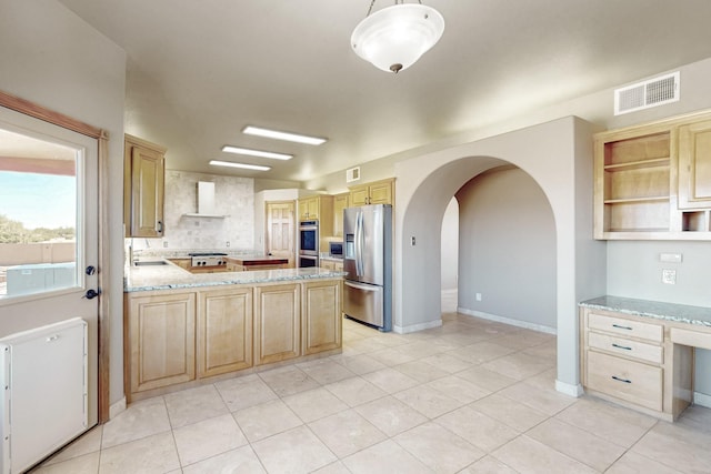 5 La Aguapa, Sandia Park, NM 87047 - kitchen featuring stainless steel appliances, light brown cabinetry, wall chimney exhaust hood, a peninsula, and light tile patterned floors
