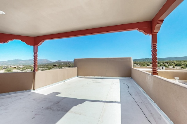 5 La Aguapa, Sandia Park, NM 87047 - view of patio featuring a mountain view and a balcony