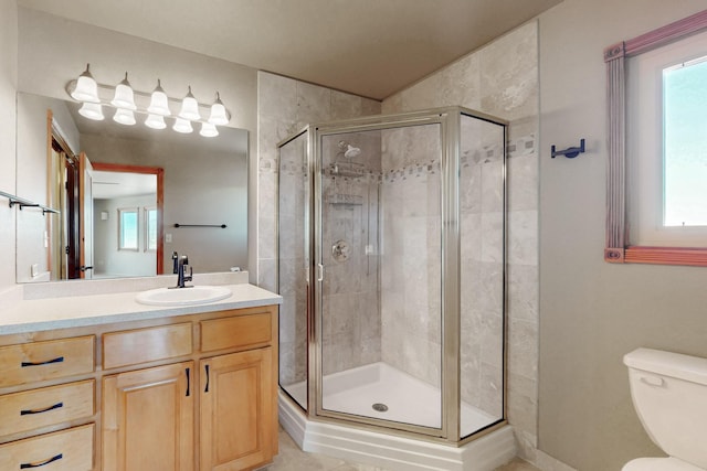 5 La Aguapa, Sandia Park, NM 87047 - bathroom with vanity, a stall shower, and toilet