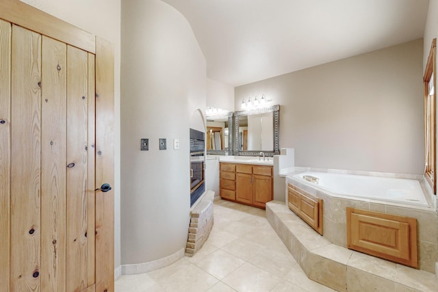 5 La Aguapa, Sandia Park, NM 87047 - full bathroom with a garden tub, vanity, and tile patterned flooring
