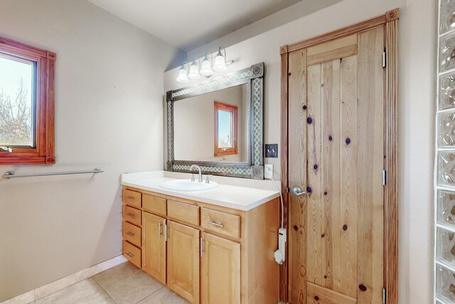 5 La Aguapa, Sandia Park, NM 87047 - bathroom featuring vanity, tile patterned flooring, and baseboards