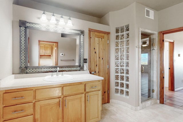 5 La Aguapa, Sandia Park, NM 87047 - bathroom featuring vanity, a stall shower, and tile patterned floors