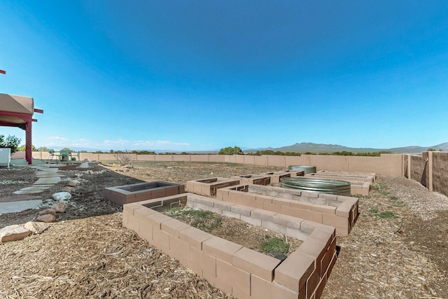 5 La Aguapa, Sandia Park, NM 87047 - view of yard featuring a vegetable garden and a mountain view