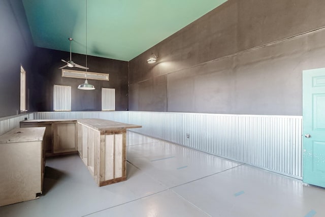 5 La Aguapa, Sandia Park, NM 87047 - kitchen with concrete floors, pendant lighting, and wainscoting