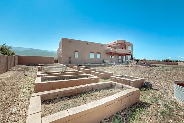 5 La Aguapa, Sandia Park, NM 87047 - fenced backyard featuring a vegetable garden and a mountain view