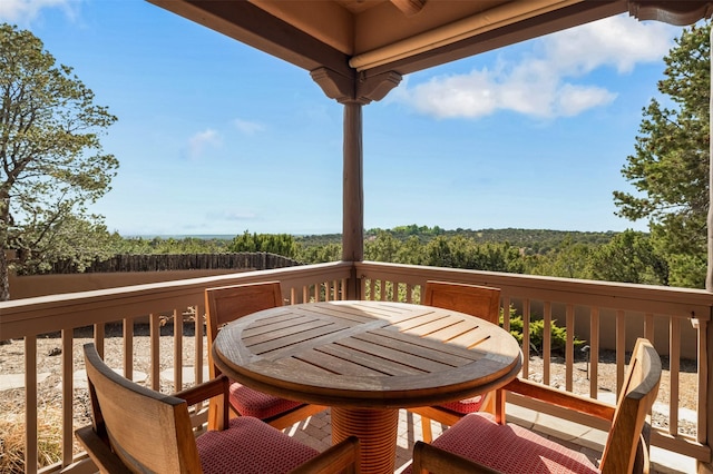 1050 Sierra Del Norte, Santa Fe, NM 87501 - wooden terrace with outdoor dining area