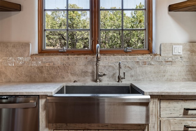 1050 Sierra Del Norte, Santa Fe, NM 87501 - kitchen with stainless steel dishwasher, decorative backsplash, a sink, light countertops, and plenty of natural light