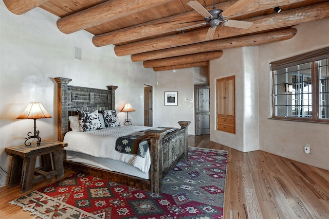 1050 Sierra Del Norte, Santa Fe, NM 87501 - bedroom featuring wood finished floors and wood ceiling with exposed beams