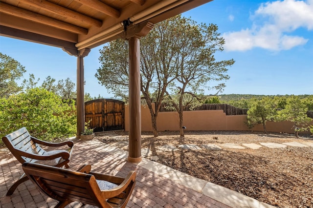 1050 Sierra Del Norte, Santa Fe, NM 87501 - fenced backyard featuring a patio area