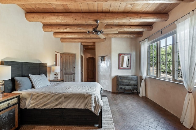 1050 Sierra Del Norte, Santa Fe, NM 87501 - bedroom featuring brick flooring and wood ceiling with exposed beams