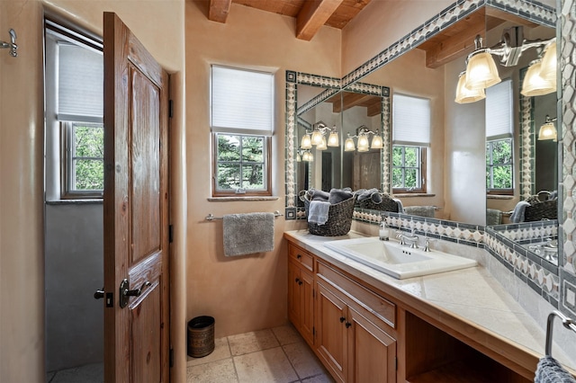 1050 Sierra Del Norte, Santa Fe, NM 87501 - bathroom featuring beamed ceiling and vanity