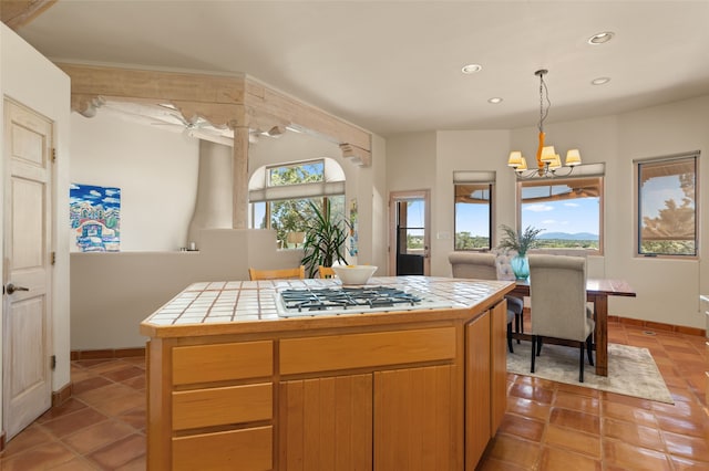 28 Camino Caballos, Lamy, NM 87540 - kitchen featuring tile counters, a chandelier, recessed lighting, white gas stovetop, and light tile patterned floors