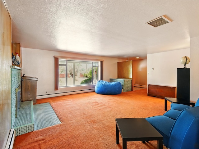 707 Middle San Pedro Rd, Espanola, NM 87532 - living room with a baseboard heating unit, a fireplace, a baseboard radiator, carpet, and a textured ceiling