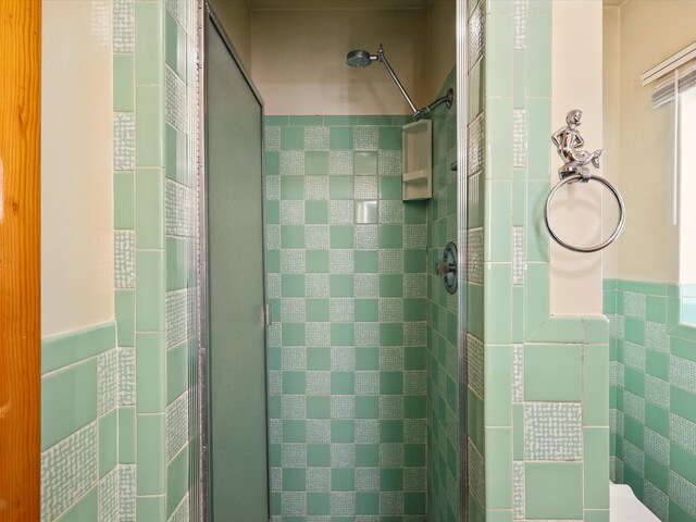 707 Middle San Pedro Rd, Espanola, NM 87532 - bathroom with a shower stall and tile walls