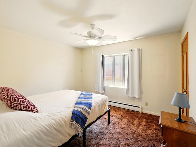 707 Middle San Pedro Rd, Espanola, NM 87532 - bedroom with baseboard heating, carpet flooring, ceiling fan, and baseboards