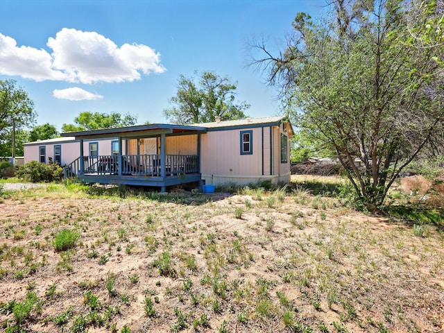 707 Middle San Pedro Rd, Espanola, NM 87532 - rear view of house featuring a wooden deck
