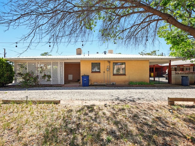 707 Middle San Pedro Rd, Espanola, NM 87532 - view of front of home featuring a chimney and metal roof