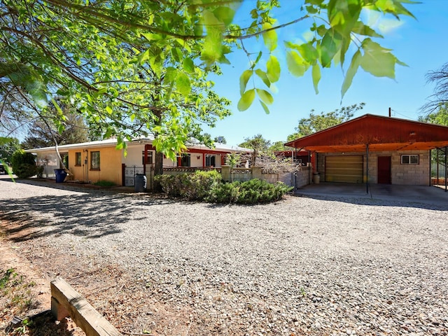 707 Middle San Pedro Rd, Espanola, NM 87532 - single story home with driveway and a garage