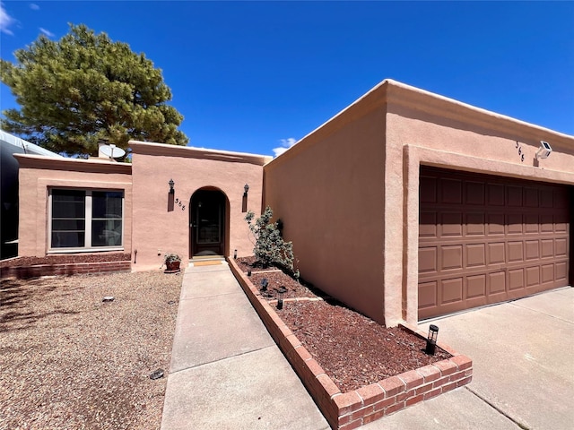 368 Bryce, White Rock, NM 87547 - view of front of property featuring stucco siding and a garage