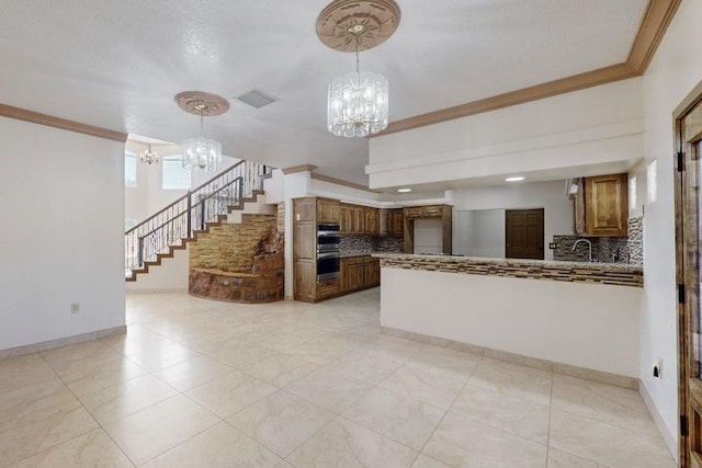 1521 Lakeview Rd SW, Albuquerque, NM 87105 - unfurnished living room with a chandelier, ornamental molding, stairway, baseboards, and a sink