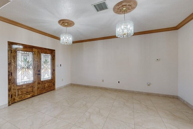 1521 Lakeview Rd SW, Albuquerque, NM 87105 - foyer entrance with a chandelier, ornamental molding, french doors, and baseboards