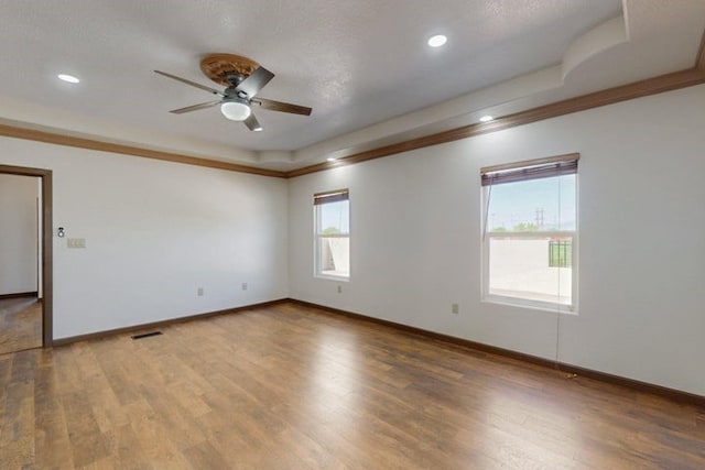 1521 Lakeview Rd SW, Albuquerque, NM 87105 - unfurnished room with ceiling fan, wood finished floors, a tray ceiling, baseboards, and ornamental molding