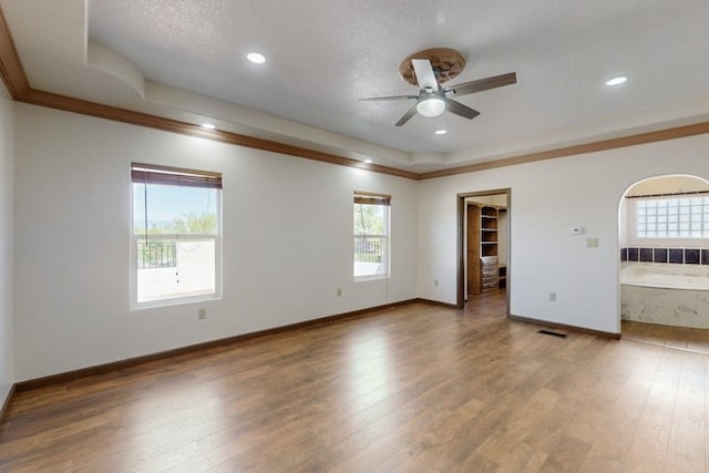 1521 Lakeview Rd SW, Albuquerque, NM 87105 - empty room with a ceiling fan, wood finished floors, crown molding, baseboards, and recessed lighting
