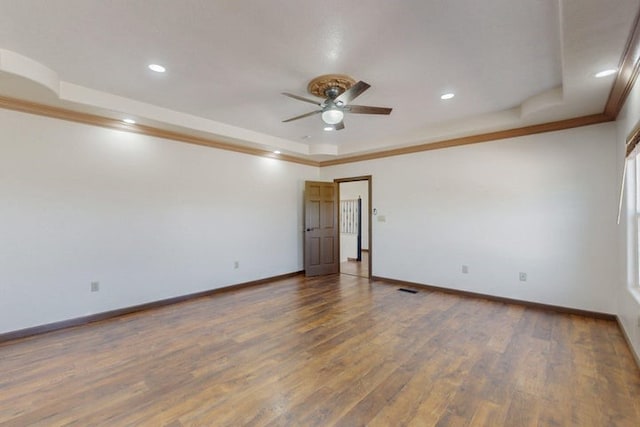 1521 Lakeview Rd SW, Albuquerque, NM 87105 - empty room featuring a tray ceiling, ceiling fan, ornamental molding, baseboards, and wood finished floors