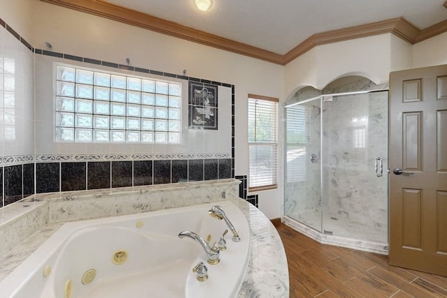1521 Lakeview Rd SW, Albuquerque, NM 87105 - bathroom with crown molding, a jetted tub, a stall shower, and wood finished floors