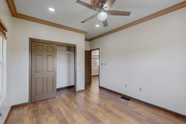 1521 Lakeview Rd SW, Albuquerque, NM 87105 - unfurnished bedroom featuring crown molding, baseboards, wood finished floors, recessed lighting, and a closet