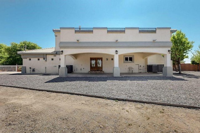 1521 Lakeview Rd SW, Albuquerque, NM 87105 - rear view of property featuring stucco siding, a patio area, and french doors