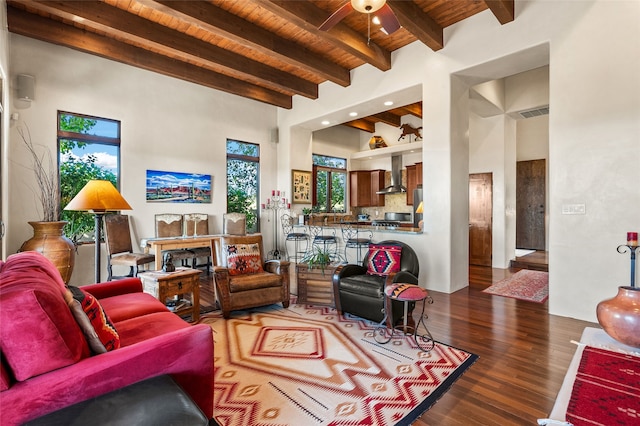 14 Avenida Sebastian, Santa Fe, NM 87506 - living area featuring wood ceiling with exposed beams, wood finished floors, ceiling fan, and a towering ceiling