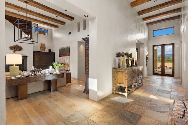 20 Rising Moon, Santa Fe, NM 87506 - foyer entrance with a high ceiling, beam ceiling, and wood finished floors