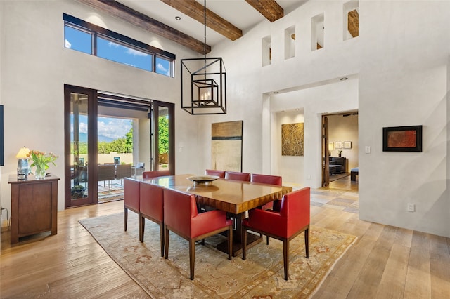20 Rising Moon, Santa Fe, NM 87506 - dining area featuring a high ceiling, light wood finished floors, and beam ceiling