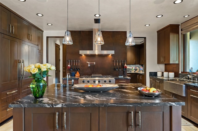 20 Rising Moon, Santa Fe, NM 87506 - kitchen featuring a sink, recessed lighting, a large island, dark stone counters, and decorative backsplash
