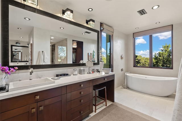 20 Rising Moon, Santa Fe, NM 87506 - full bath with a freestanding bath, vanity, recessed lighting, and tile patterned floors