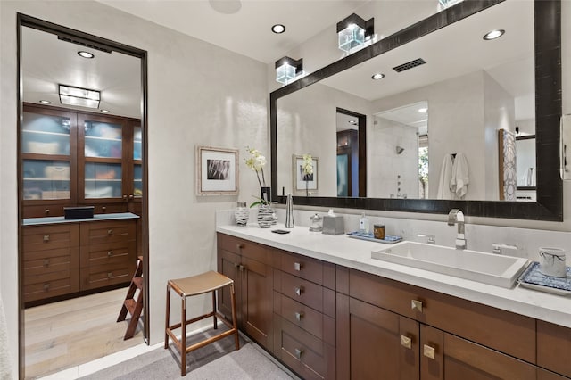 20 Rising Moon, Santa Fe, NM 87506 - bathroom featuring vanity, tiled shower, and recessed lighting
