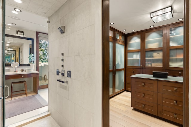 20 Rising Moon, Santa Fe, NM 87506 - full bathroom featuring vanity, a shower with shower door, wood finished floors, and recessed lighting