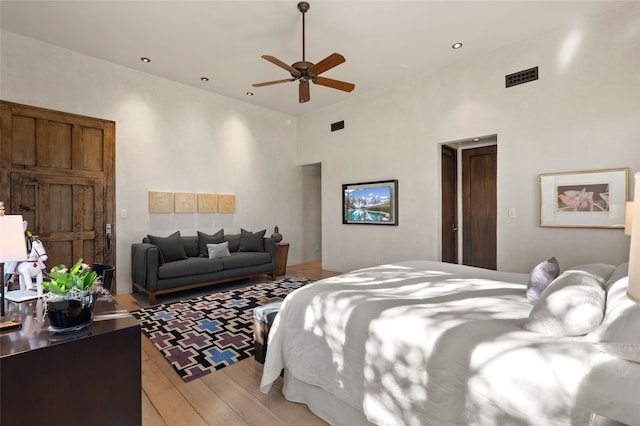 20 Rising Moon, Santa Fe, NM 87506 - bedroom featuring light wood finished floors, a towering ceiling, recessed lighting, and ceiling fan