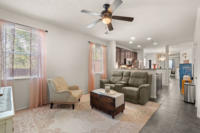 5910 Monte Rosa St, Santa Fe, NM 87507 - tiled living area featuring a ceiling fan, recessed lighting, a textured ceiling, and baseboards