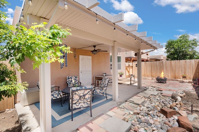 5910 Monte Rosa St, Santa Fe, NM 87507 - view of patio / terrace featuring a fire pit and ceiling fan
