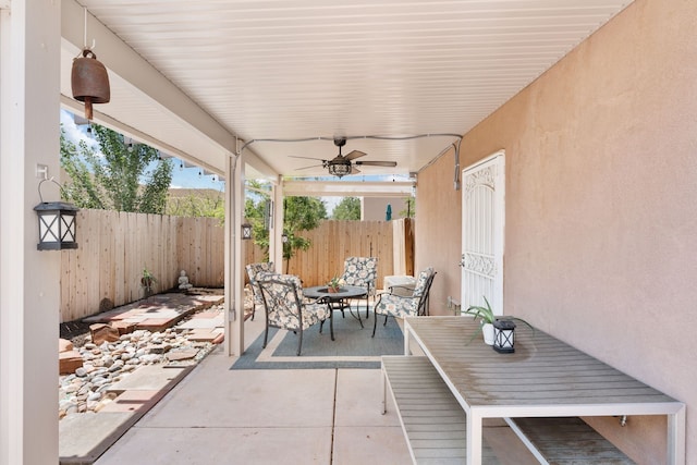 5910 Monte Rosa St, Santa Fe, NM 87507 - fenced backyard with a patio area, outdoor dining area, and a ceiling fan