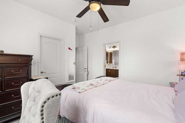 5910 Monte Rosa St, Santa Fe, NM 87507 - bedroom featuring ceiling fan, connected bathroom, and a sink